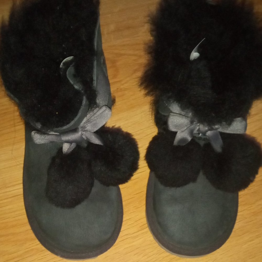 UGG black girl boots with pom poms. USA 10